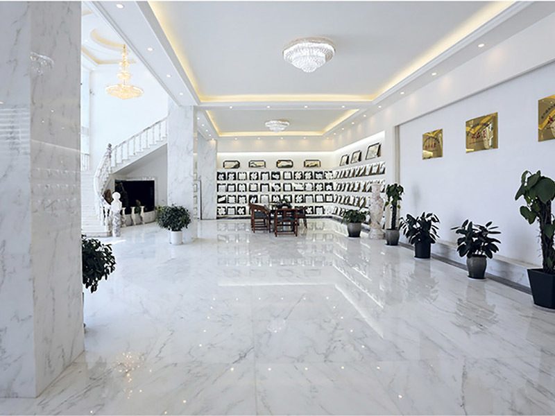 The showroom hall in white marble with framed samples