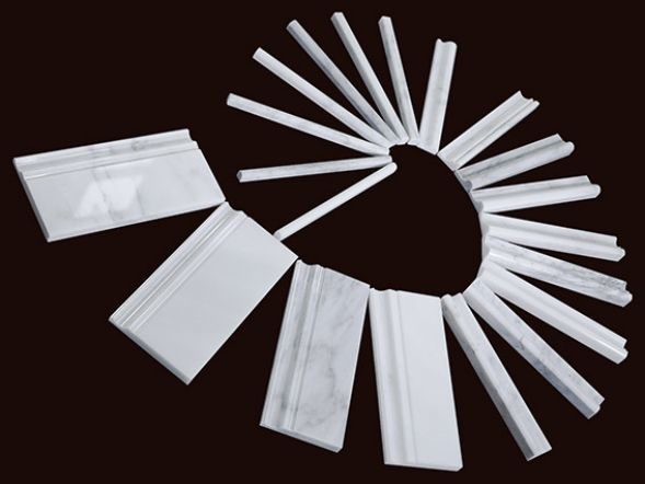 A fan of white marble moulding profiles